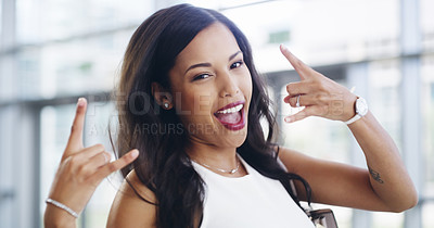 Buy stock photo Cropped shot of a young businesswoman showing a shaka hand sign while walking through a modern office