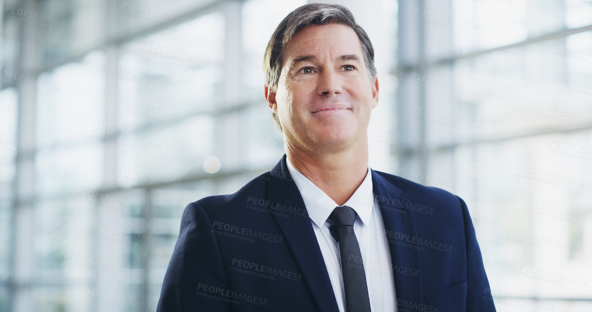 Buy stock photo Cropped shot of a mature businessman walking through a modern office