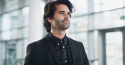 Buy stock photo Cropped shot of a confident young businessman walking through a modern office