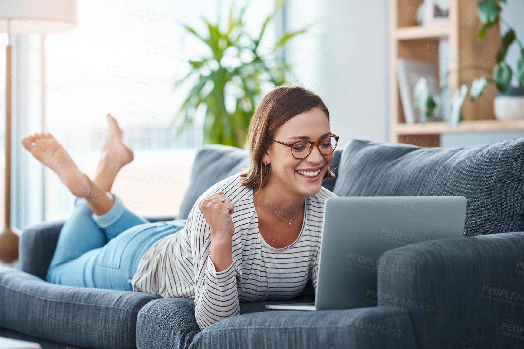 Buy stock photo Happy, woman and fist with laptop for success at house of reading email, winner announcement and achievement. Smile, girl and relax with online news, giveaway bonus and promotion deal of notification