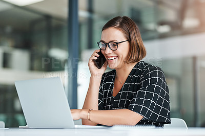 Buy stock photo Cropped shot of a happy young businesswoman taking a call while working in an office