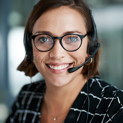 Buy stock photo Cropped portrait of a happy young call centre agent working in an office
