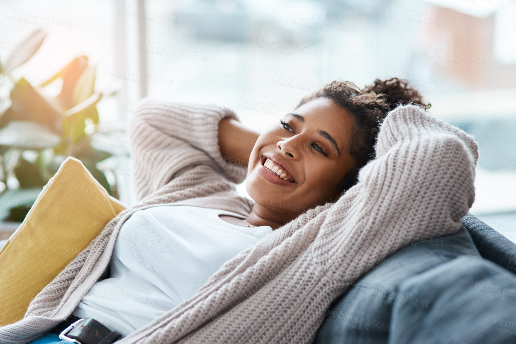 Buy stock photo Woman, stretching and happy on sofa for relax, comfort and positivity in home living room. Girl, student and smile on couch for study break, stress free and optimistic on weekend in Brazil apartment