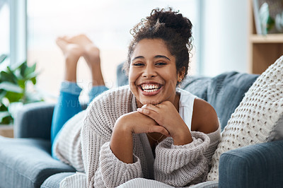 Buy stock photo Full length portrait of a happy young woman relaxing on her couch at home