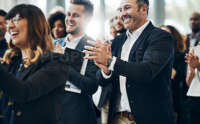 Buy stock photo Cropped shot of a group of businesspeople applauding during a seminar in the conference room