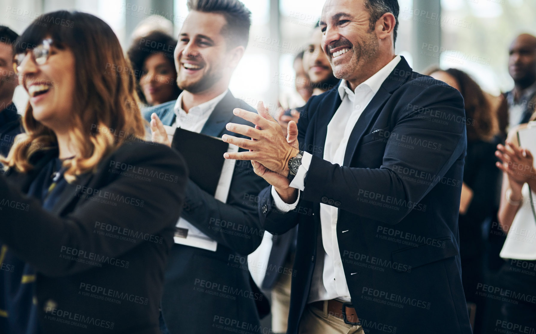 Buy stock photo Cropped shot of a group of businesspeople applauding during a seminar in the conference room