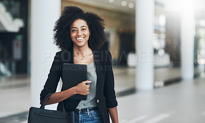 Buy stock photo Portrait of a confident young businesswoman standing with a digital tablet inside of the office at work