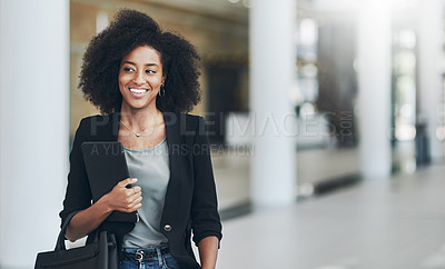Buy stock photo Shot of a confident young businesswoman standing with a digital tablet inside of the office at work