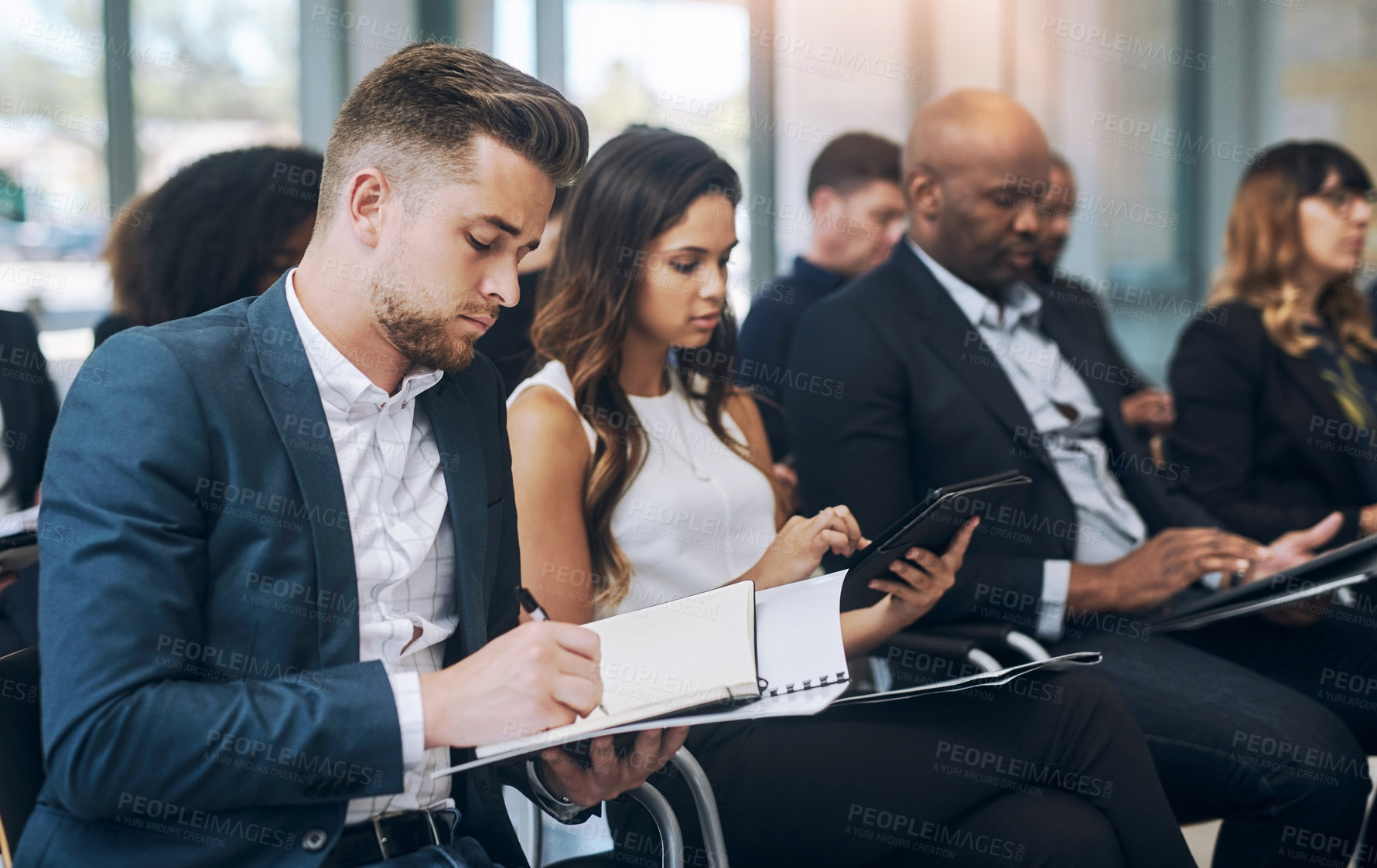 Buy stock photo Business, people and writing notes in conference at office for seminar, instruction and learning. Corporate, employees and workshop or convention as audience for information, knowledge or career