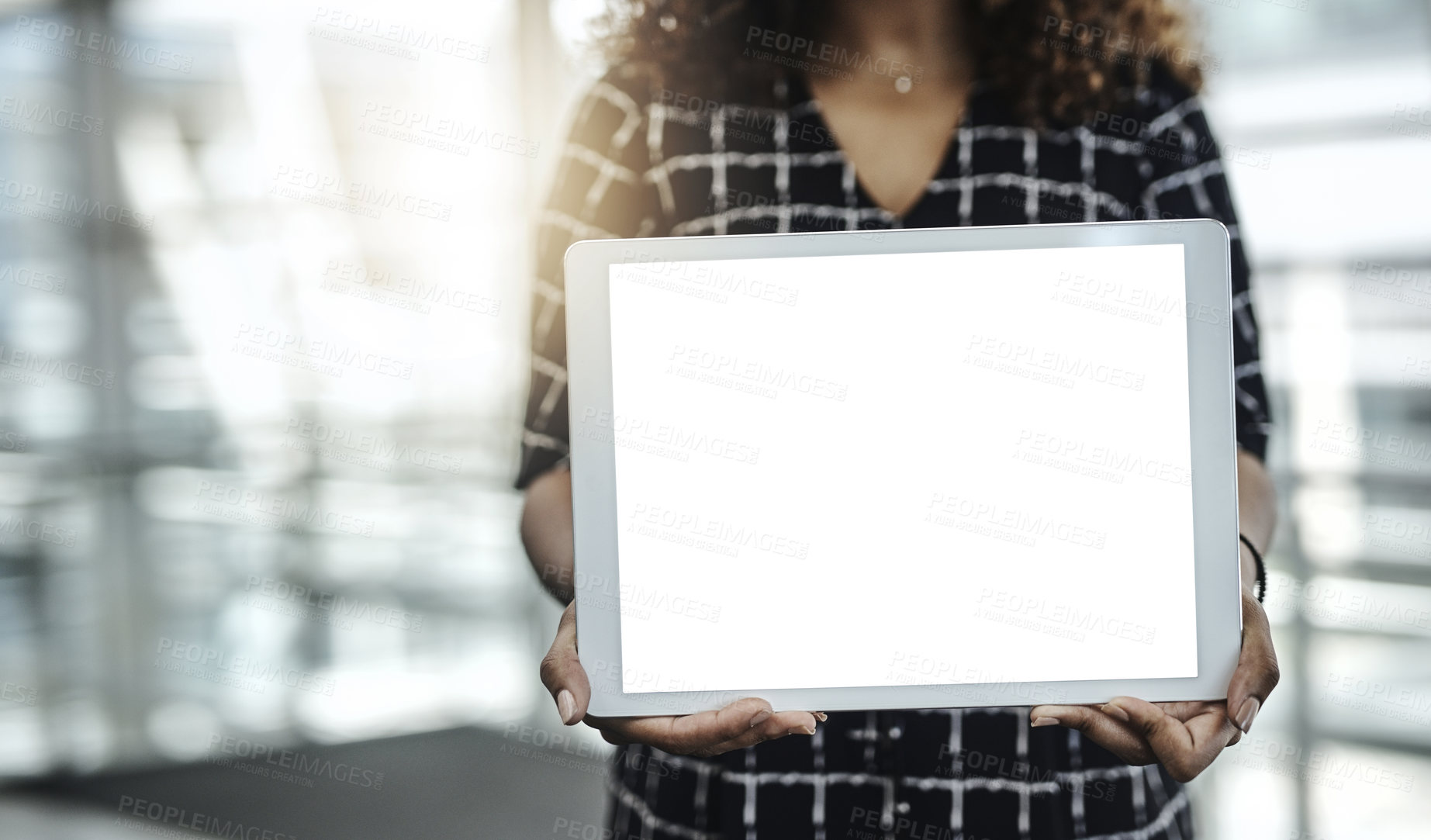 Buy stock photo Cropped shot of an unrecognizable businesswoman displaying a digital tablet in a modern office