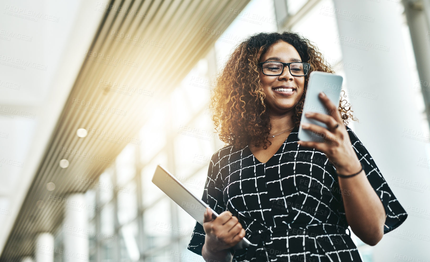 Buy stock photo Business, smile and black woman with a smartphone, typing and connection in the workplace. Female person, employee and consultant with a cellphone, check schedule and search internet for information