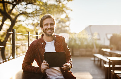 Buy stock photo Cropped portrait of a handsome young man showing you the screen of his digital tablet outside