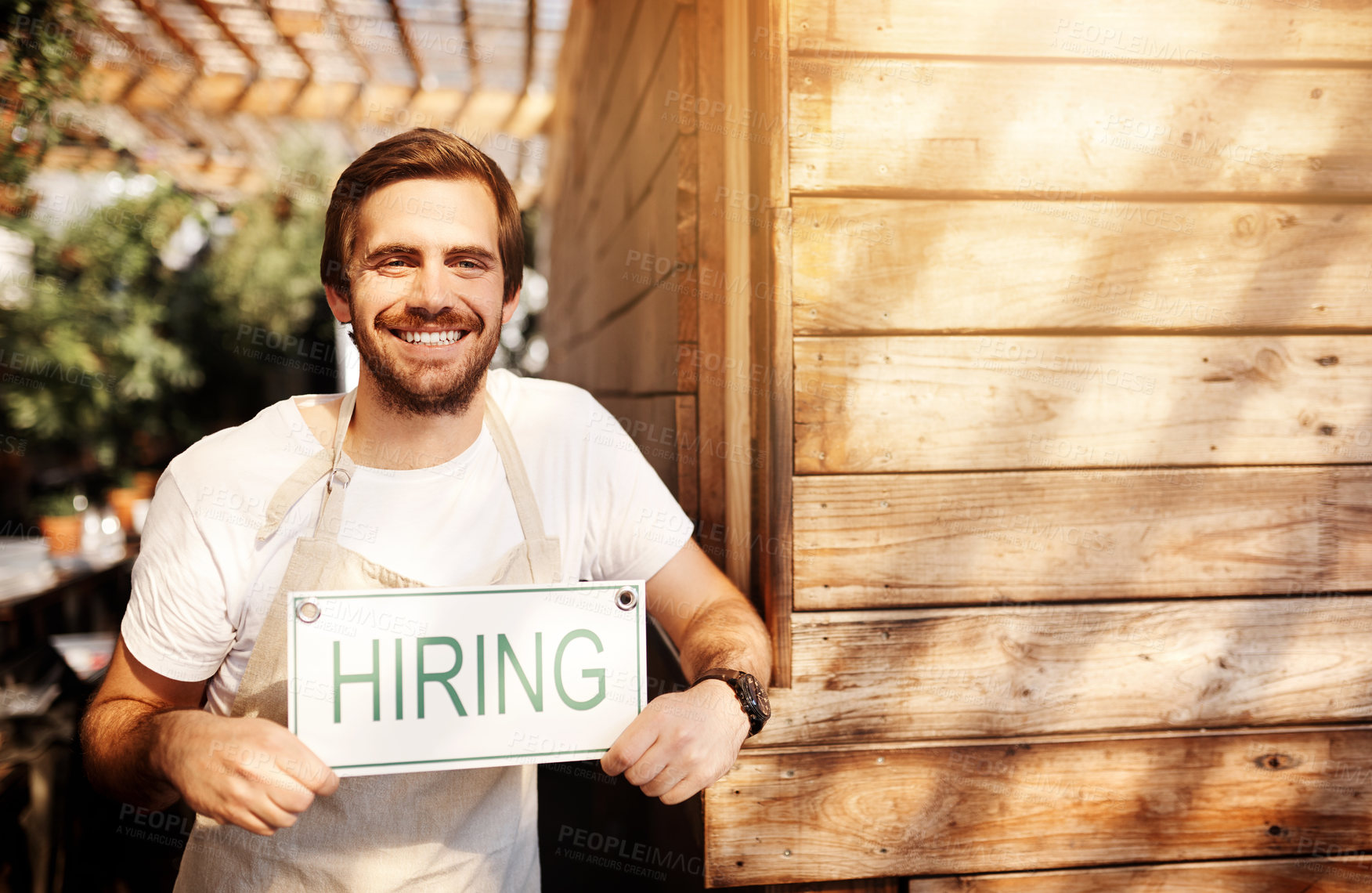 Buy stock photo Happy, waiter and man at cafe with hiring sign in confidence for startup and ownership. Coffee shop, small business and smile or satisfied at restaurant with poster for job or career opportunity