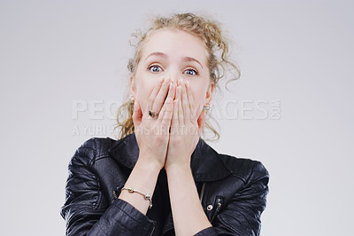 Buy stock photo Surprise, gossip and portrait of woman in studio for fake news, announcement or mistake with worry. Shock, emotion and person with hands on mouth for wow, omg or wtf expression by gray background.