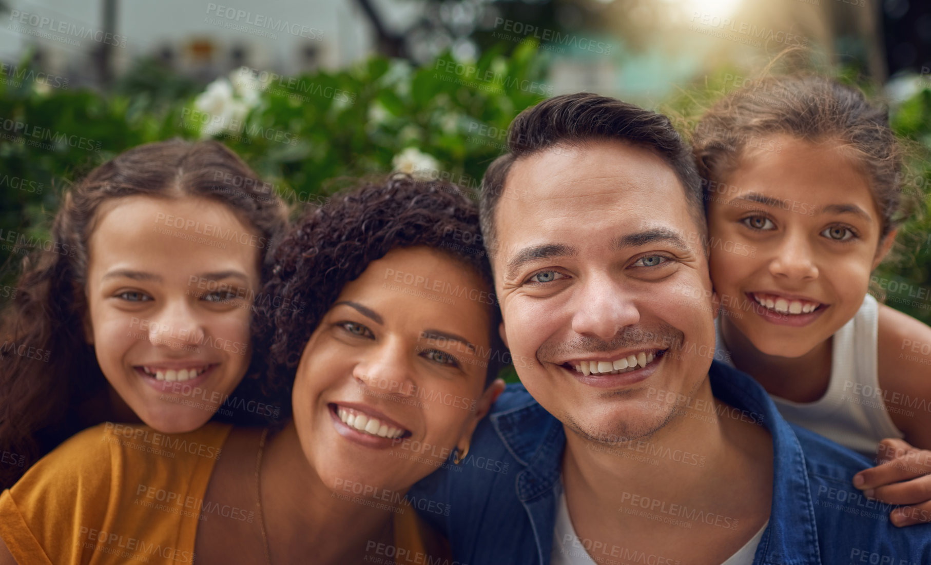 Buy stock photo Cropped portrait of a happy family spending some time together at the park