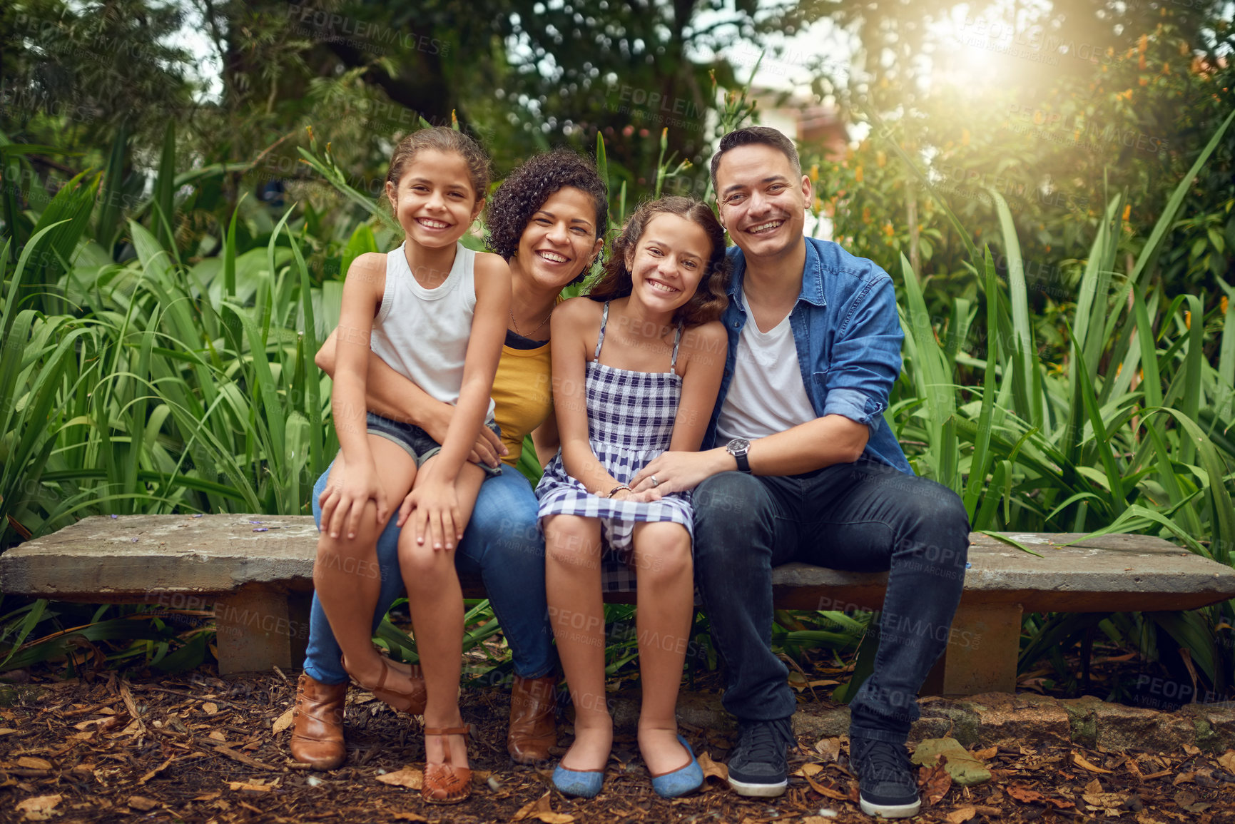 Buy stock photo Portrait, love and happy family on bench in park with smile or kids in garden for bonding together. Parents, dad or mom in nature with care, hug or children siblings on holiday vacation in France