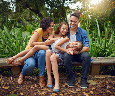 Buy stock photo Playing, love or happy family on bench in park with smile or kids in nature garden for bonding together. Parents, dad or mom in home with care, joy or children siblings on holiday vacation in France