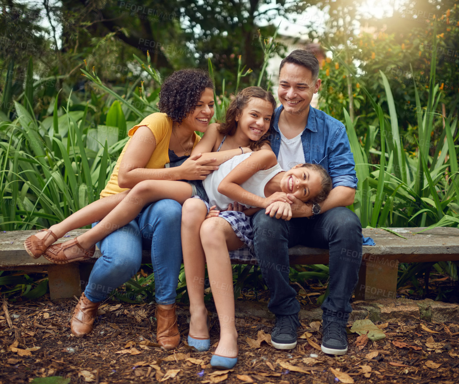 Buy stock photo Playing, love or happy family on bench in park with smile or kids in nature garden for bonding together. Parents, dad or mom in home with care, joy or children siblings on holiday vacation in France