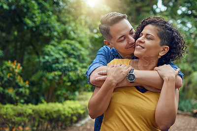 Buy stock photo Cropped shot of an affectionate couple embracing each other at the park