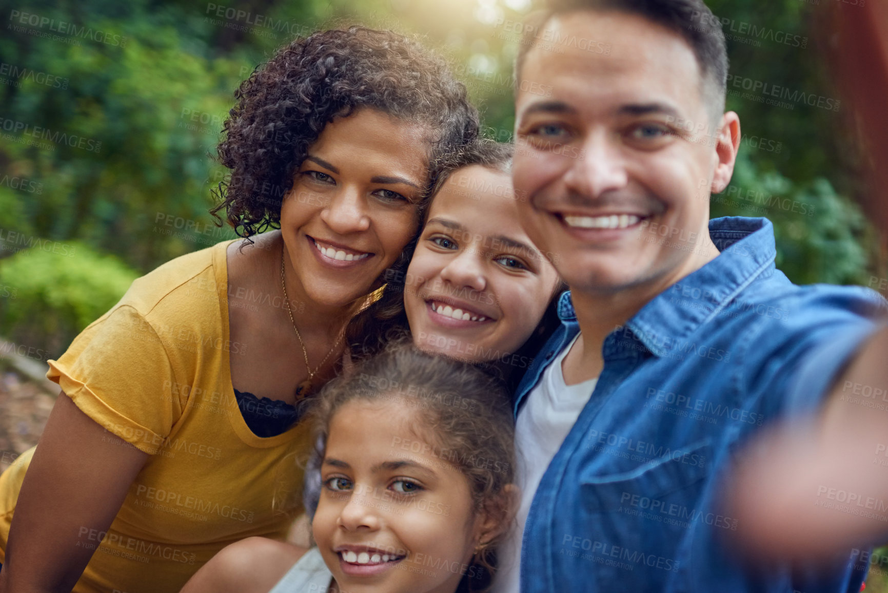 Buy stock photo Selfie, parents and children in garden with smile, embrace and outdoor bonding together in park. Photography, happy family and weekend fun in nature with mom, dad and girl kids relax in backyard