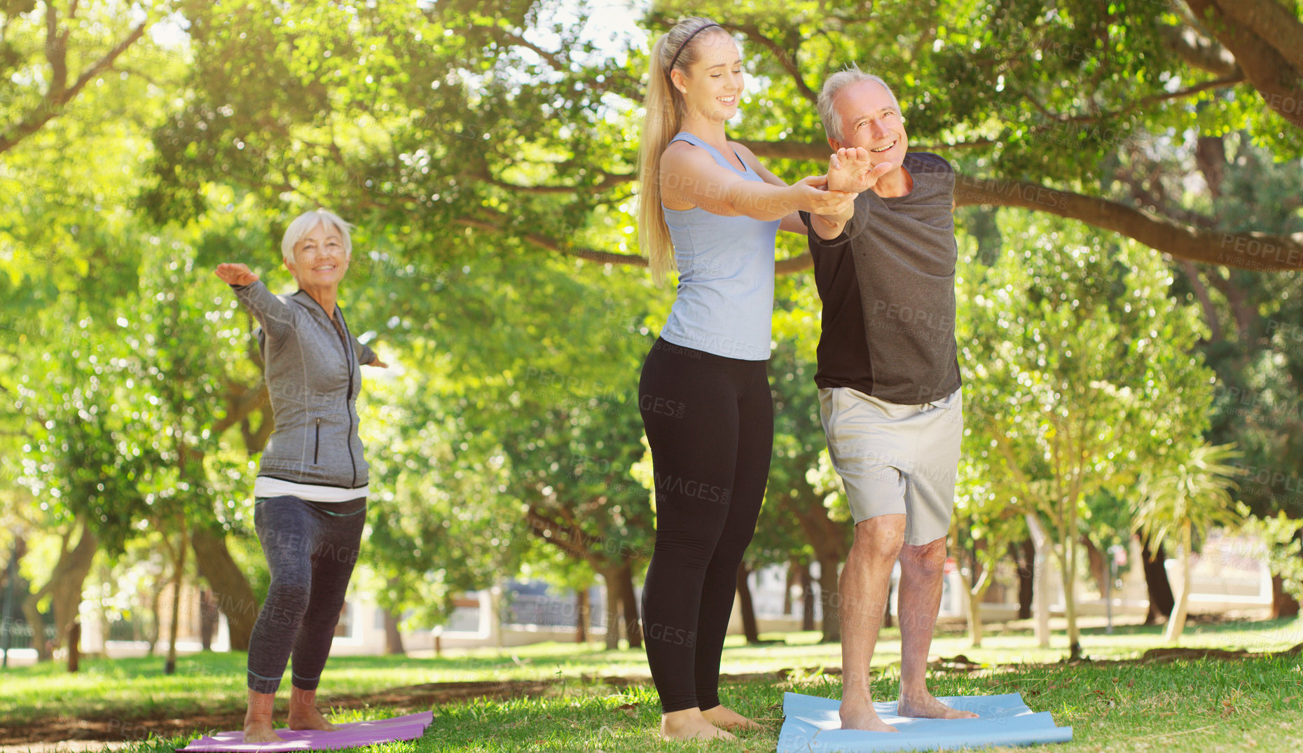 Buy stock photo Yoga, wellness and an old couple with their personal trainer in a park for a health or active lifestyle. Exercise, fitness or zen and senior people outdoor for a workout with their pilates coach