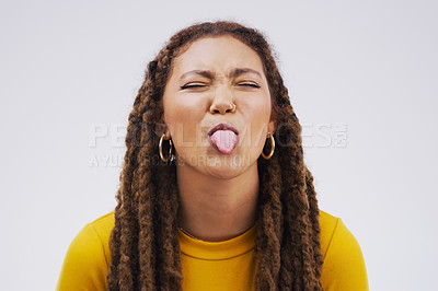 Buy stock photo Portrait, funny face and tongue with a black woman joking in studio on a white background for humor. Comic, comedy and braids on eyes with a playful young female person eyes closed for an emoji