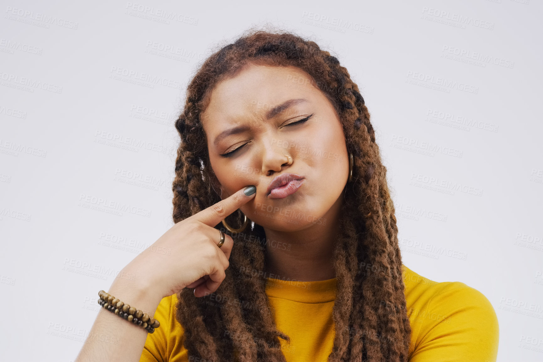 Buy stock photo Finger, funny face and pout with a black woman joking in studio on a white background for humor. Comic, comedy and duckface with a pouting young female person feeling playful while having fun
