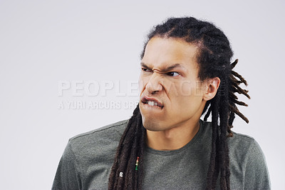 Buy stock photo Man, funny face and goofy expression on mockup space against a white studio background. Young male person or model with silly faces and braids for comedy, comic or crazy mood and strange attitude