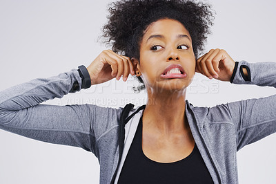 Buy stock photo Funny face, pulling ears and an african woman in studio on a gray background, thinking while looking silly or goofy. Comedy, comic and idea with a crazy young female person joking for fun or humor