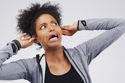 Buy stock photo Surprise, funny face and ears with an african woman in studio on a gray background looking silly or goofy. Comedy, comic and shock with a crazy young female person in awe of hearing news while joking
