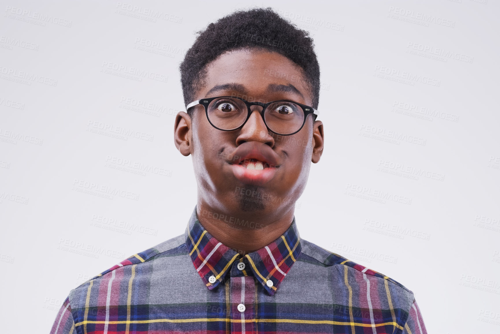 Buy stock photo Funny face, comic and portrait of a black man being crazy isolated on a white background in a studio. Geek, mouth movement and face headshot of an African person with glasses as a nerd and goofy