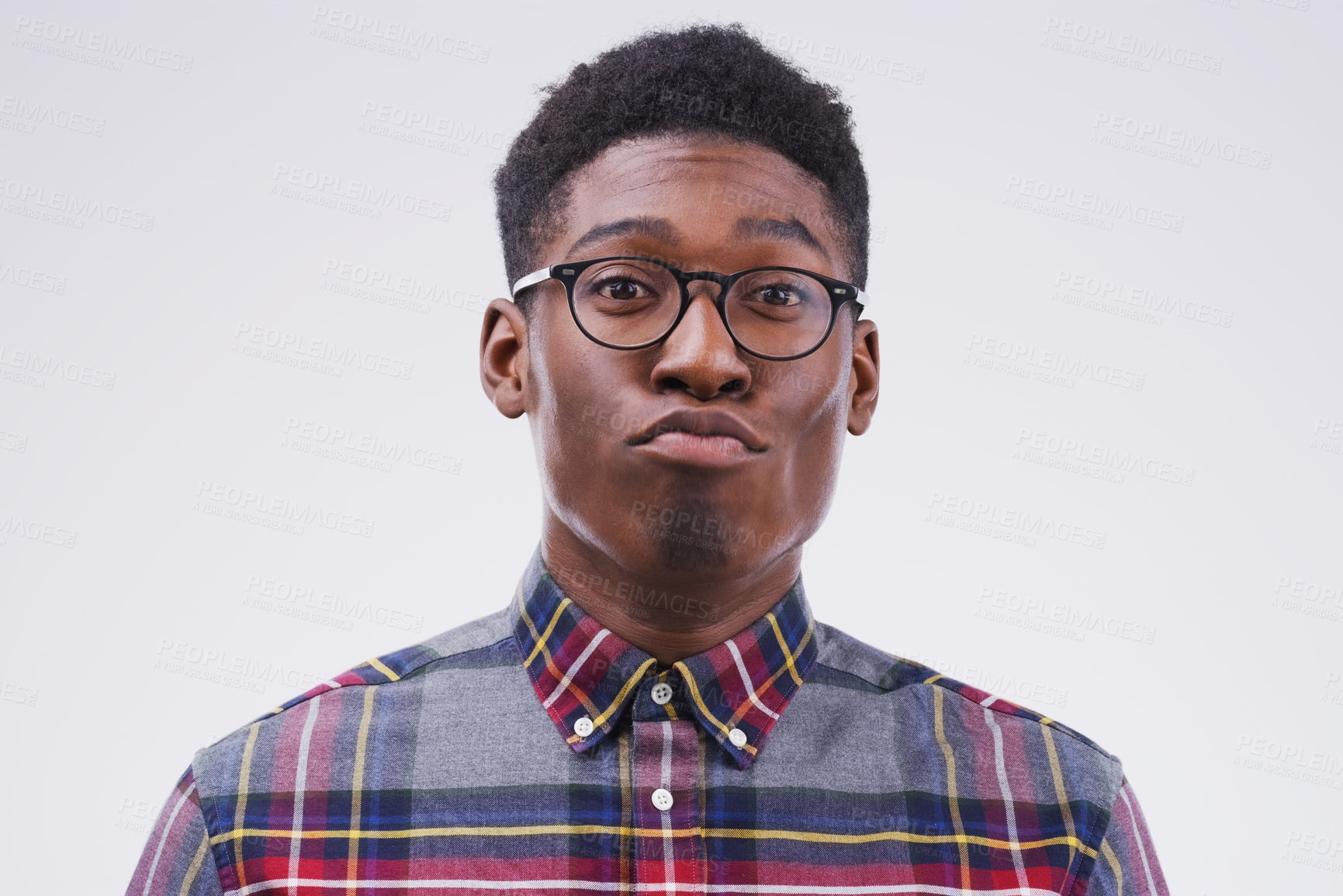 Buy stock photo Funny face, young and portrait of a black man pouting isolated on a white background in a studio. Geek, pout and a face headshot of an African person with glasses as a nerd, goofy and quirky