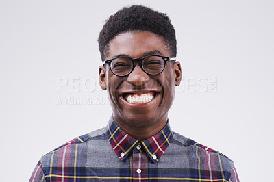 Buy stock photo Portrait, mockup and black man with a smile, funny and confident against a grey studio background. Face, male person and model with facial expression, humor and geek laughing, comic and happiness