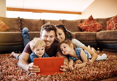 Buy stock photo Family, tablet and watching film in lounge together, relax and streaming subscription for cartoon movie. Parents, children and online for series in home, love and entertainment for happiness bonding 