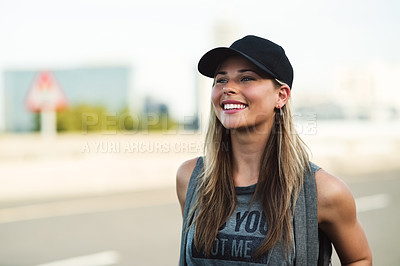 Buy stock photo Shot of an attractive young woman walking around in the city