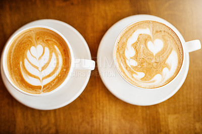 Buy stock photo High angle shot of two perfectly presented cups of cappuccino in a coffee shop