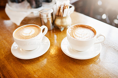 Buy stock photo High angle shot of two perfectly presented cups of cappuccino in a coffee shop