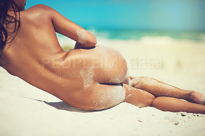 Buy stock photo Rearview shot of an unrecognizable young woman naked on beach sand
