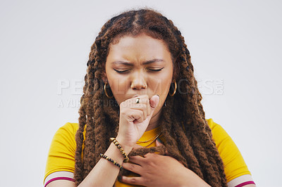 Buy stock photo Studio shot of an attractive young woman coughing against a grey background