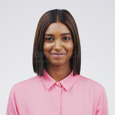 Buy stock photo Studio portrait of an attractive young woman posing against a grey background