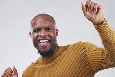 Buy stock photo Dancing, happy and portrait of black man in studio for celebration, winning prize or promotion on gray background. Movement, excited and male person for satisfaction, good news or stress relief
