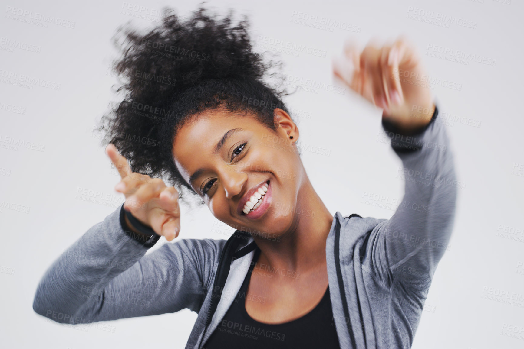 Buy stock photo Dancing, happy and portrait of black woman in studio for celebration, winning prize or promotion on gray background. Movement, excited and female person for satisfaction, good news or stress relief