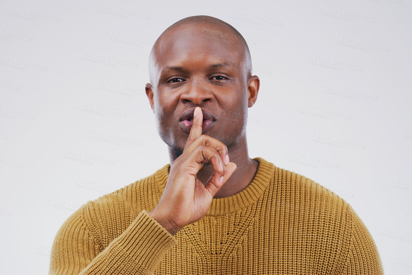 Buy stock photo Portrait, secret and shush with private black man in studio isolated on gray background for mystery. Face, finger on lips and silent with emoji hand gesture of confident person to whisper gossip
