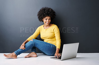 Buy stock photo Online, remote work and black woman with laptop, studio and happiness on floor with education mockup. Computer, research and college student typing on keyboard for elearning, project and studying