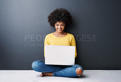 Buy stock photo Remote work, online and black woman with laptop in studio with happiness for education or class. Computer, research and college student typing on keyboard for elearning, project or studying in home