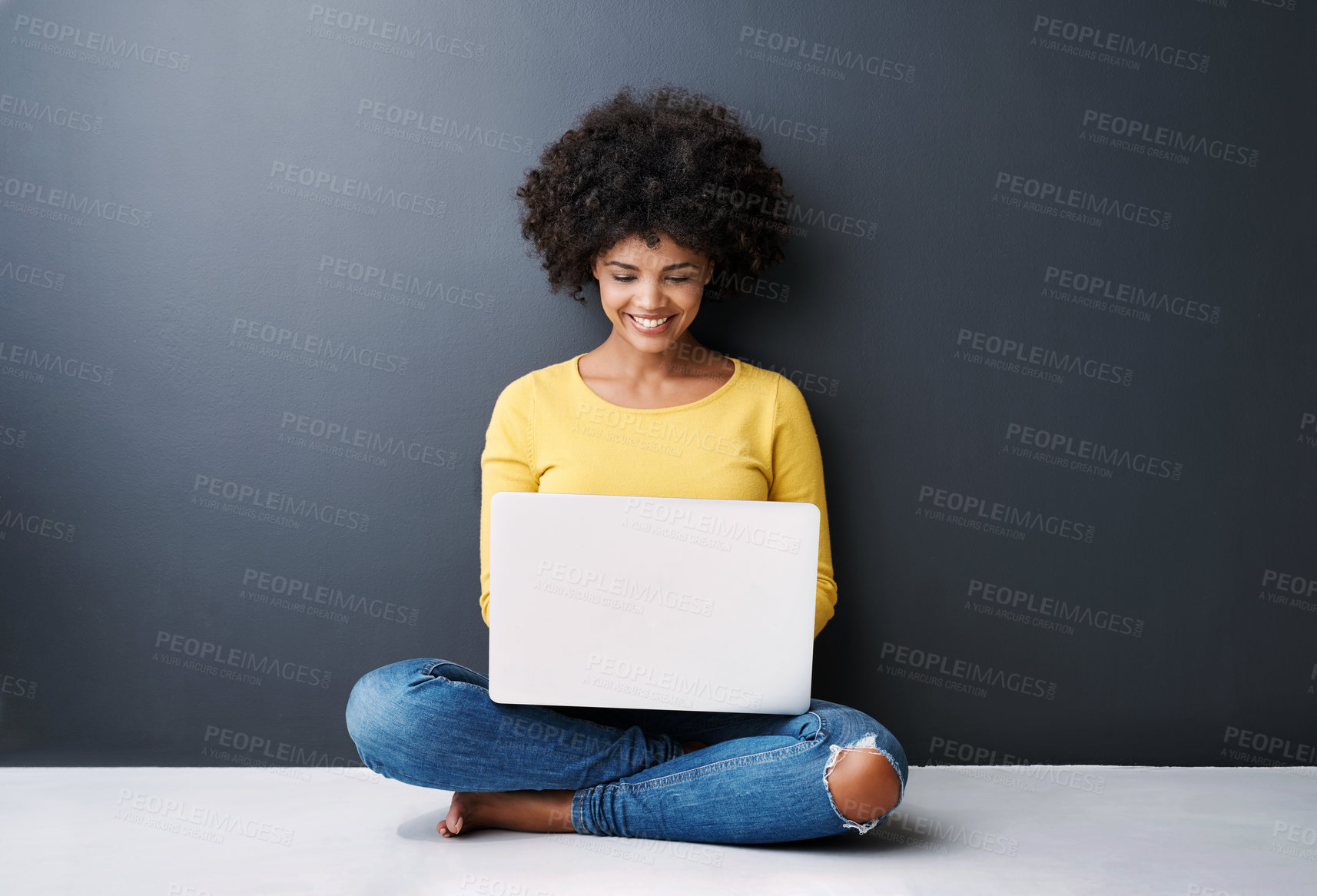 Buy stock photo Remote work, online and black woman with laptop in studio with happiness for education or class. Computer, research and college student typing on keyboard for elearning, project or studying in home
