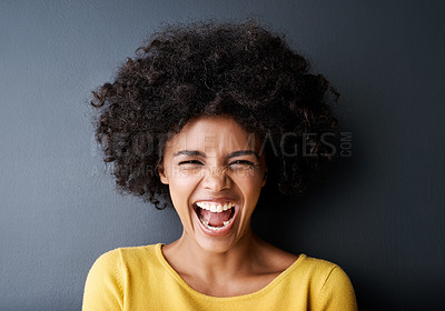 Buy stock photo Laughing, black woman and funny portrait in studio with happiness, freedom or wellness in mockup space. Happy, face and African person with smile, emoji and crazy reaction on grey background