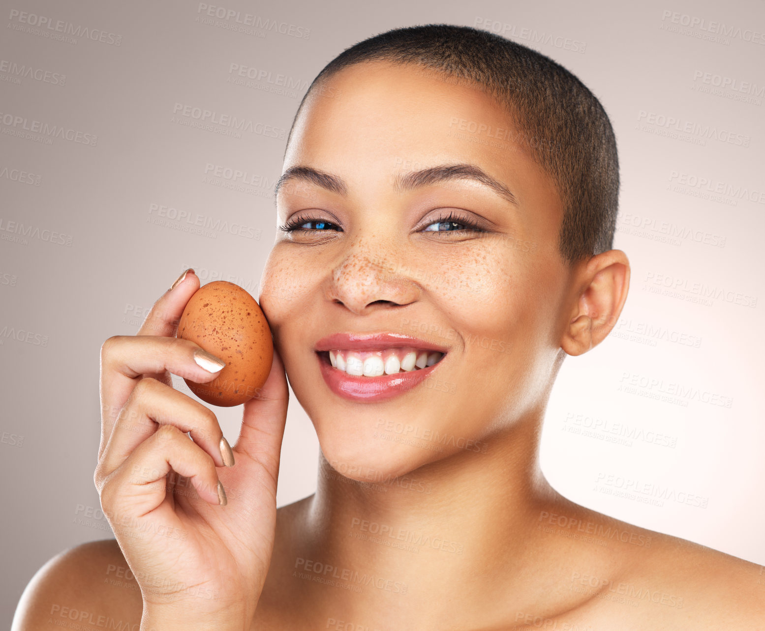 Buy stock photo Smile, skincare and portrait of woman with egg in studio for natural, cosmetic and facial treatment. Wellness, health and female model with poultry for face dermatology routine by gray background.
