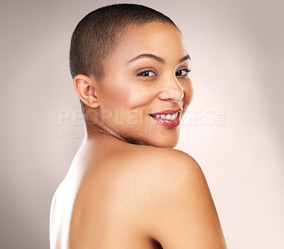 Buy stock photo Studio shot of a beautiful young woman looking over her shoulder