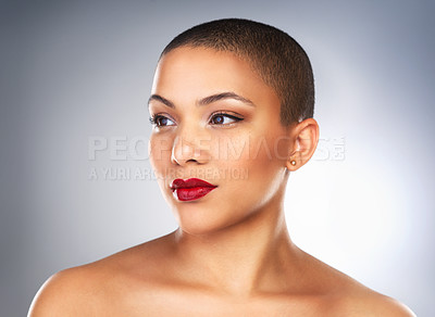 Buy stock photo Studio shot of a beautiful young woman posing with a full face of make-up